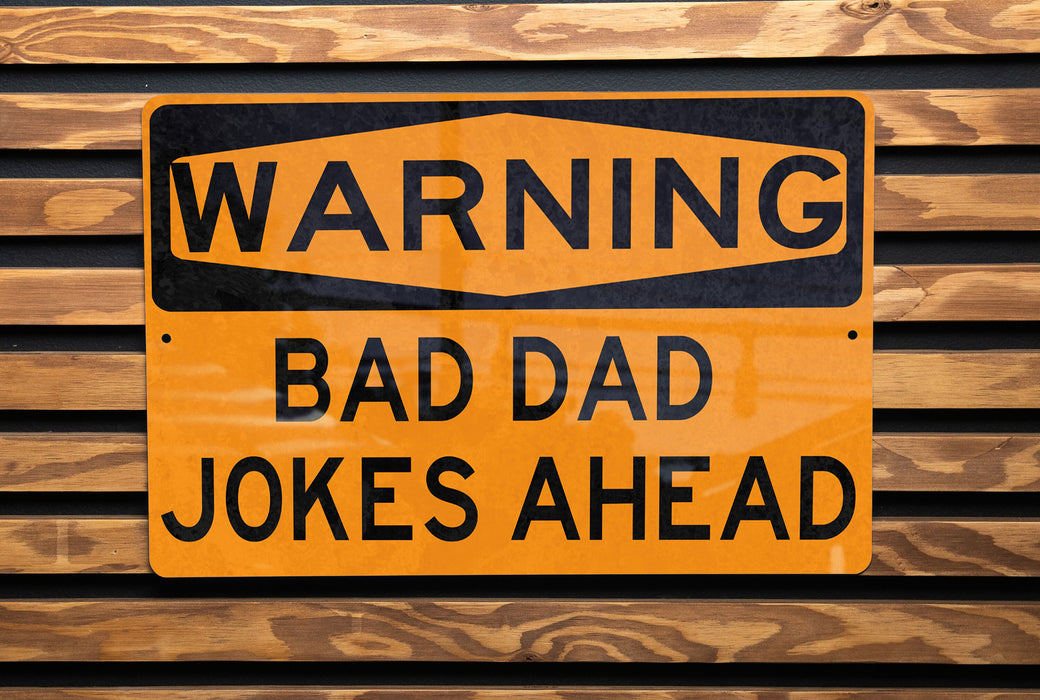 a close up of a street sign on a wooden surface