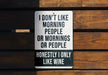 a sign on a wooden wall that says i don't like morning people or