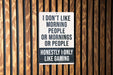 a sign on a wooden wall that says i don't like morning people or
