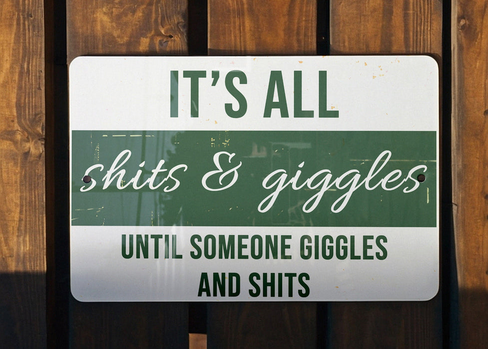 a green and white sign that says it's all shits & giggles