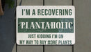 a sign that says i'm a recovering plantaholic