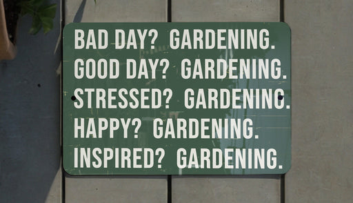 a green sign that says, bad day gardening good day gardening stressed? gardening