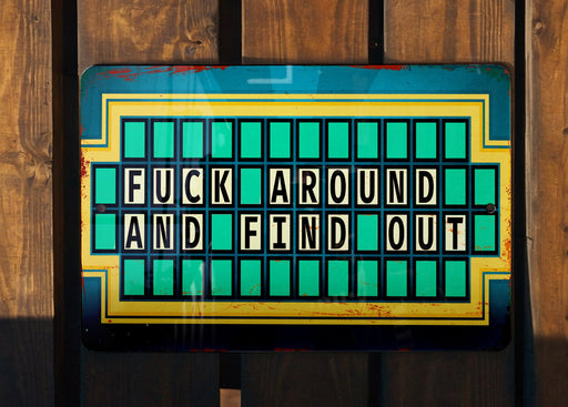 a wooden fence with a sign that says fuck around and find out