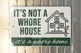 a sign that says it's not a house it's a home