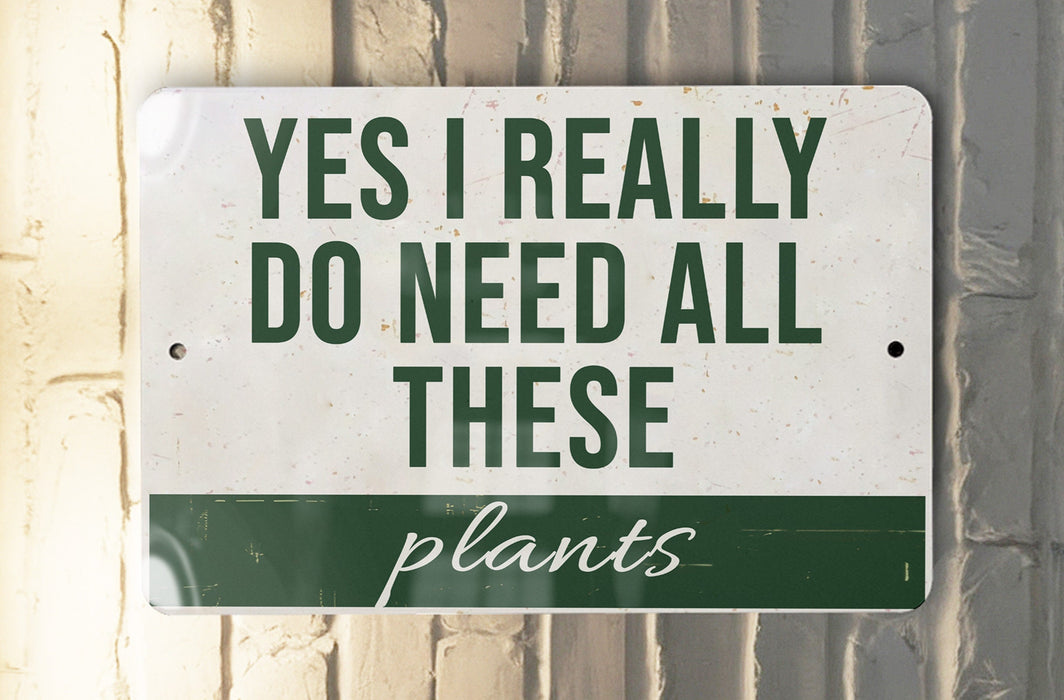 a sign that says, yes i really do need all these plants