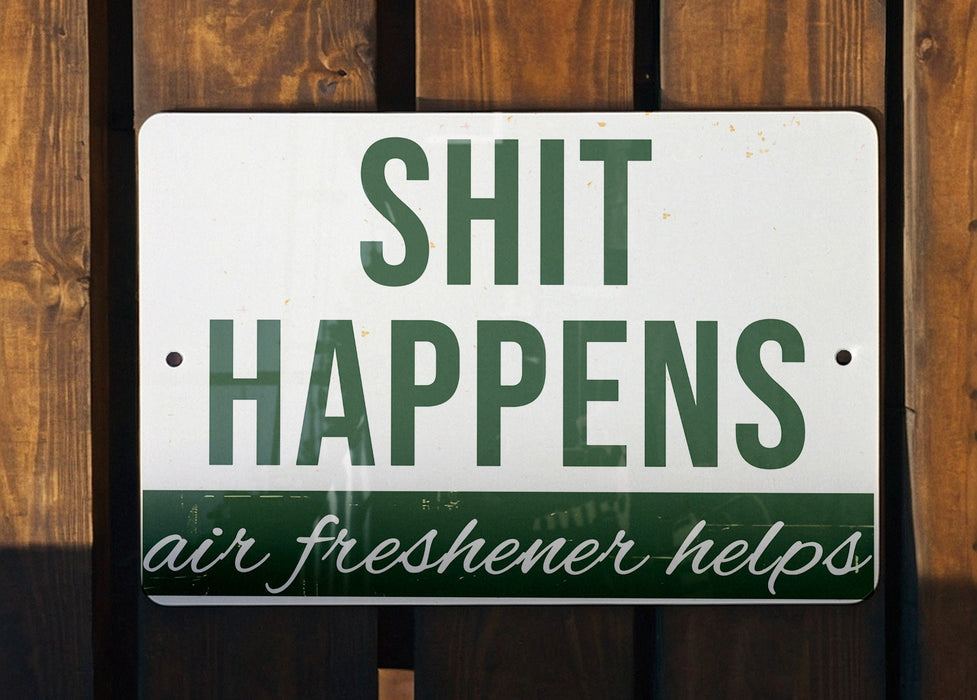 a sign that says shit happens air freshener helps