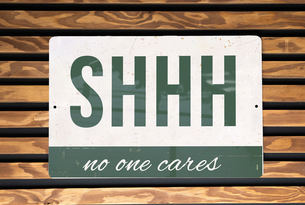 a sign that says shh no one cares
