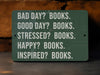 a green sign that says bad day? books good day? books stressed?