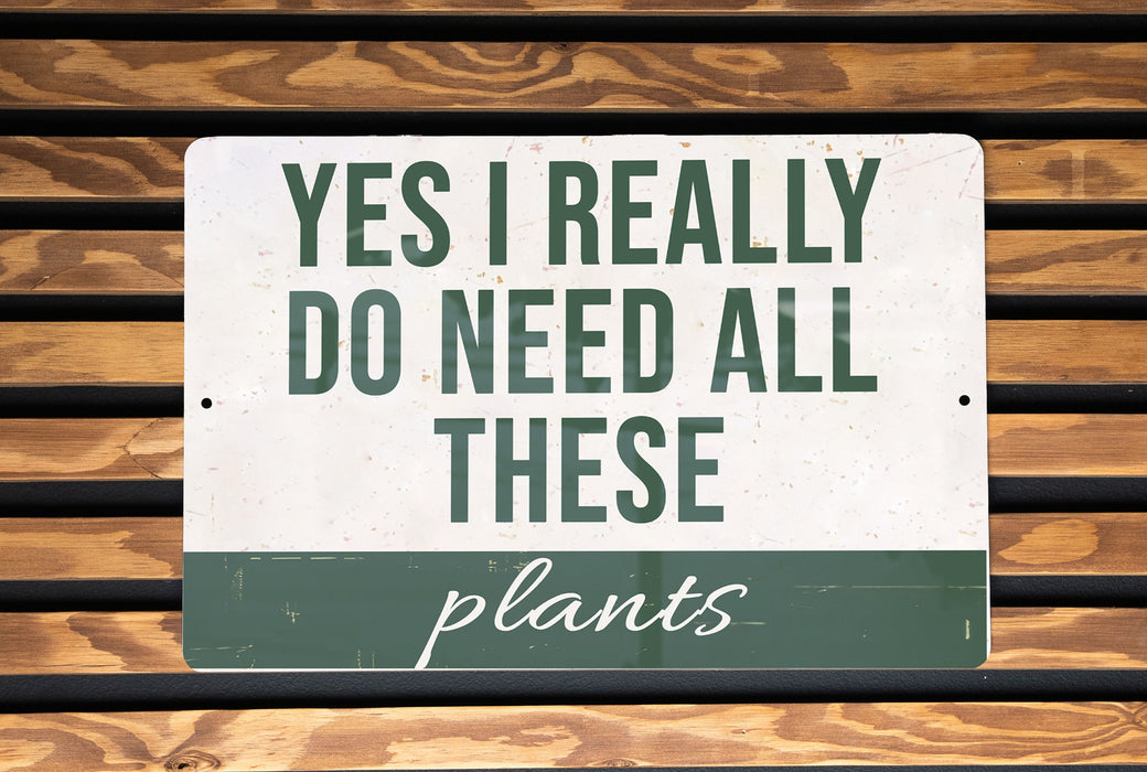 a sign that says, yes i really do need all these plants