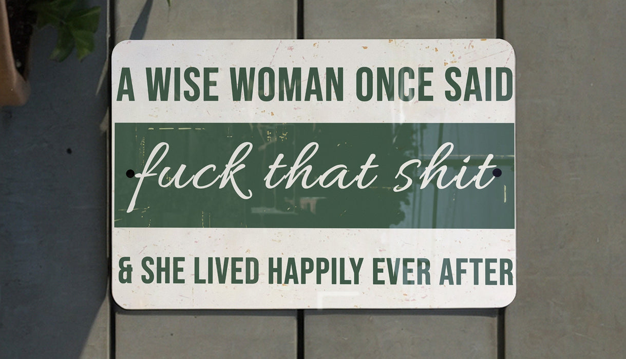 a sign that says a wise woman once said luck that shit and she lived happily