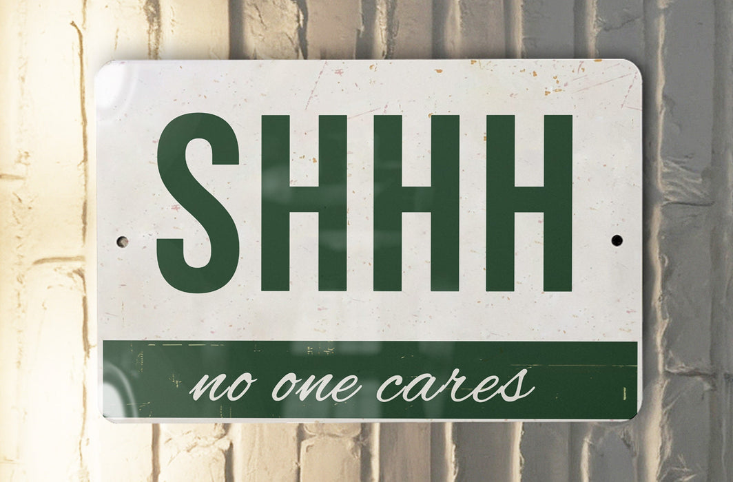 a sign that says shh no one cares