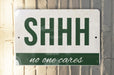 a sign that says shh no one cares