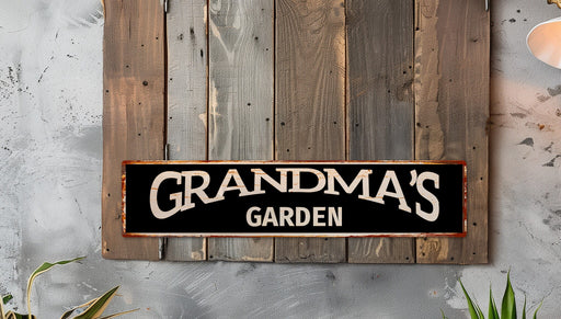 a sign that says grandma's garden hanging on a wall
