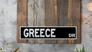 a street sign mounted to the side of a wooden wall
