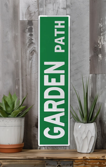 a green sign sitting on top of a wooden shelf