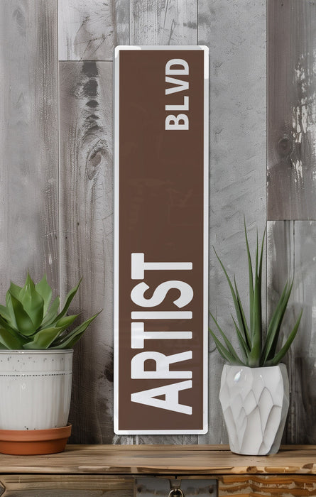 a wooden sign that says artist on it
