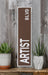 a wooden sign that says artist on it