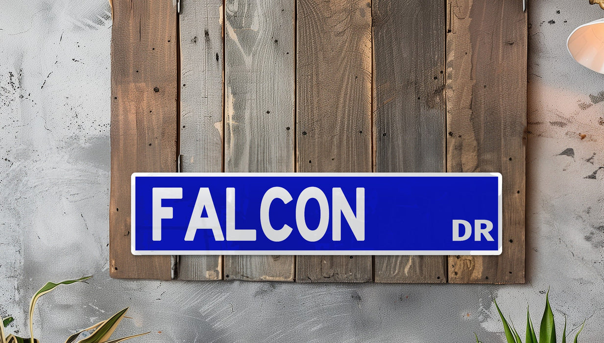 a blue street sign mounted to the side of a wooden wall