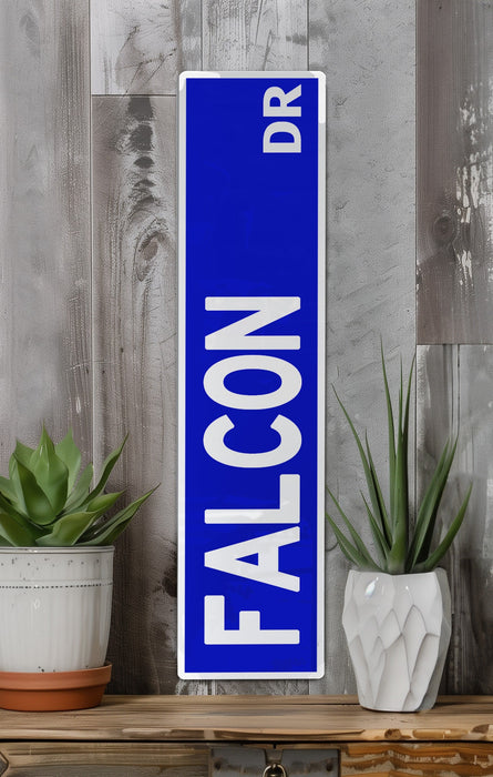 a blue sign sitting on top of a wooden shelf