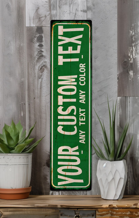 a green sign sitting on top of a wooden shelf