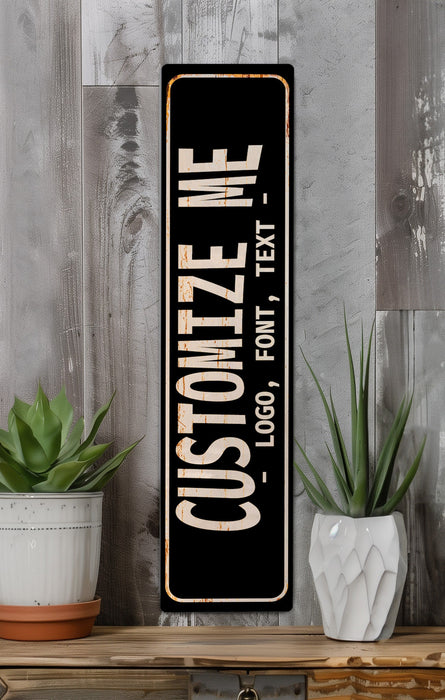 a black and white sign sitting on top of a wooden shelf