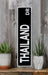 a black and white sign sitting on top of a wooden shelf