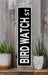 a black and white sign sitting on top of a wooden shelf