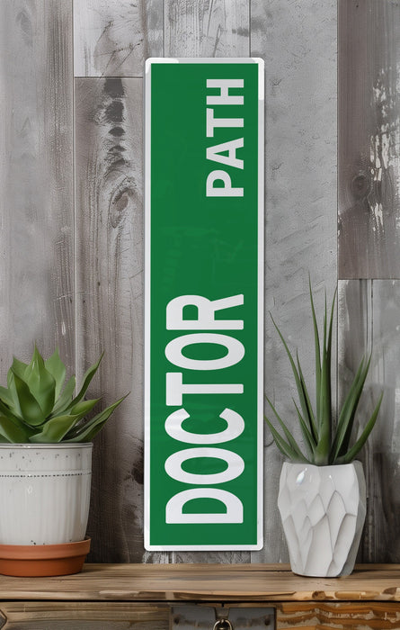 a green door sign sitting on top of a wooden shelf