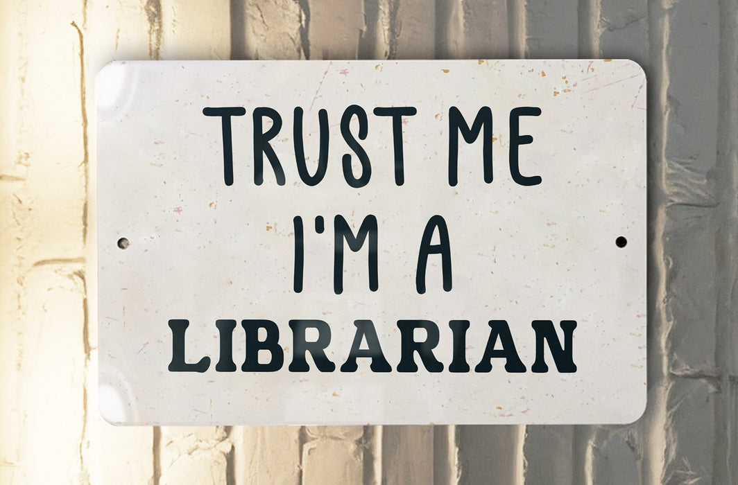 a white sign that says trust me i'm a librarian