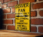 a yellow sign on a brick wall that says denver fan parking only all others are