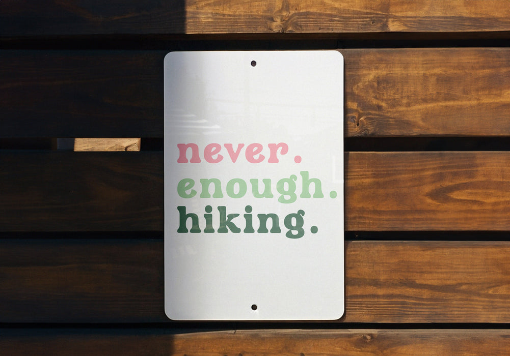 a sign that says never, enough hiking
