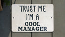 a sign that says trust me i'm a cool manager