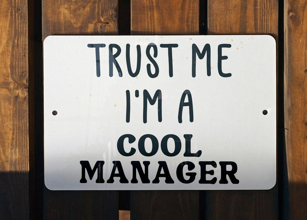 a sign that says trust me i'm a cool manager
