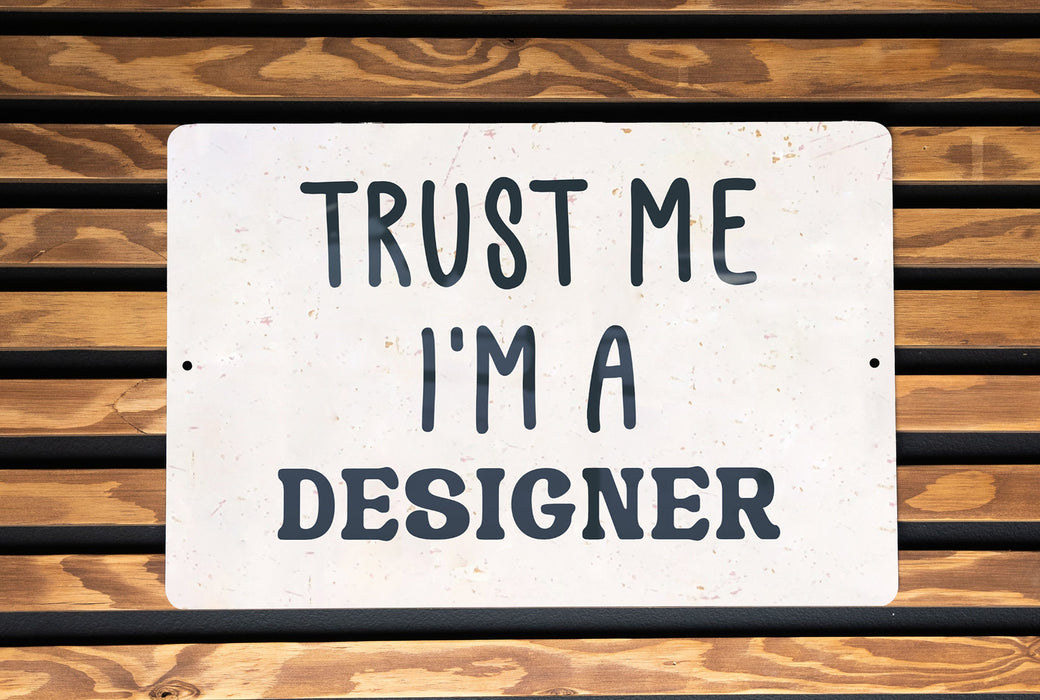 a sign that says trust me i'm a designer