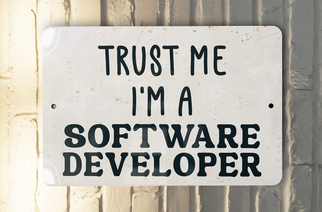 a white sign that says trust me i'm a software developer
