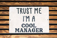 a sign that says trust me i'm a cool manager