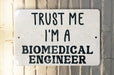a sign that says trust me i'm a biomedical engineer
