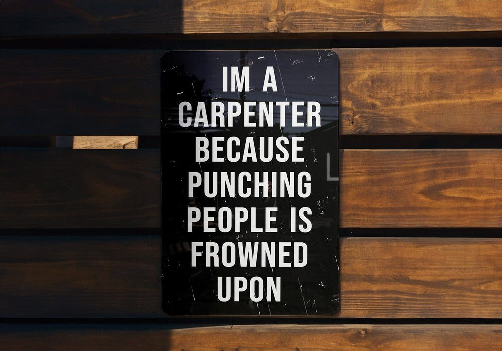a sign on a wooden bench that says i'm a carpenter because punching people