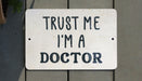 a sign that says trust me i'm a doctor