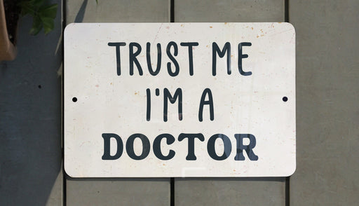 a sign that says trust me i'm a doctor