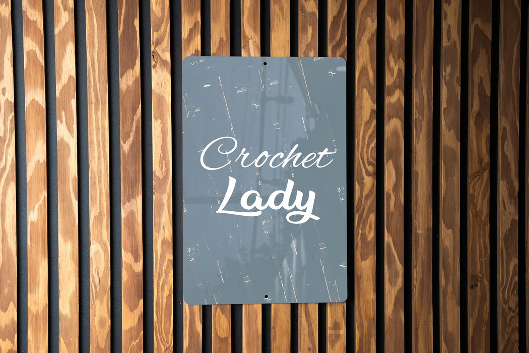 a sign on a wooden wall that says crocket lady
