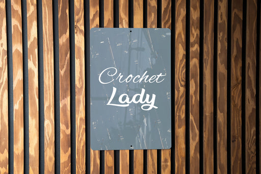 a sign on a wooden wall that says crocket lady