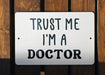 a sign that says trust me i'm a doctor