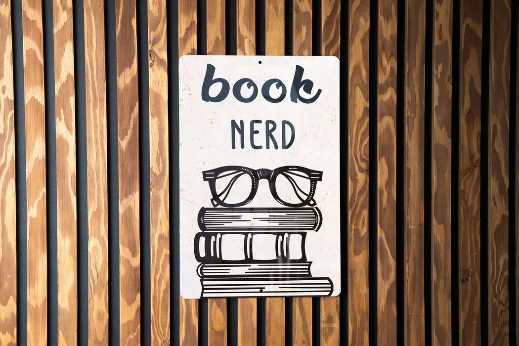 a book nerd sign on a wooden wall