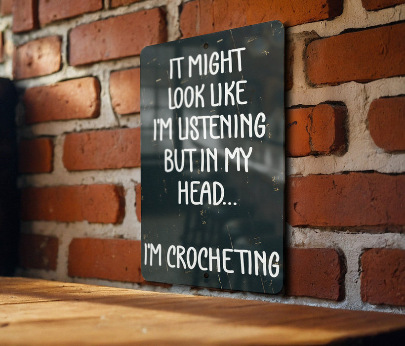 a sign that says it might look like i'm listening but in my head
