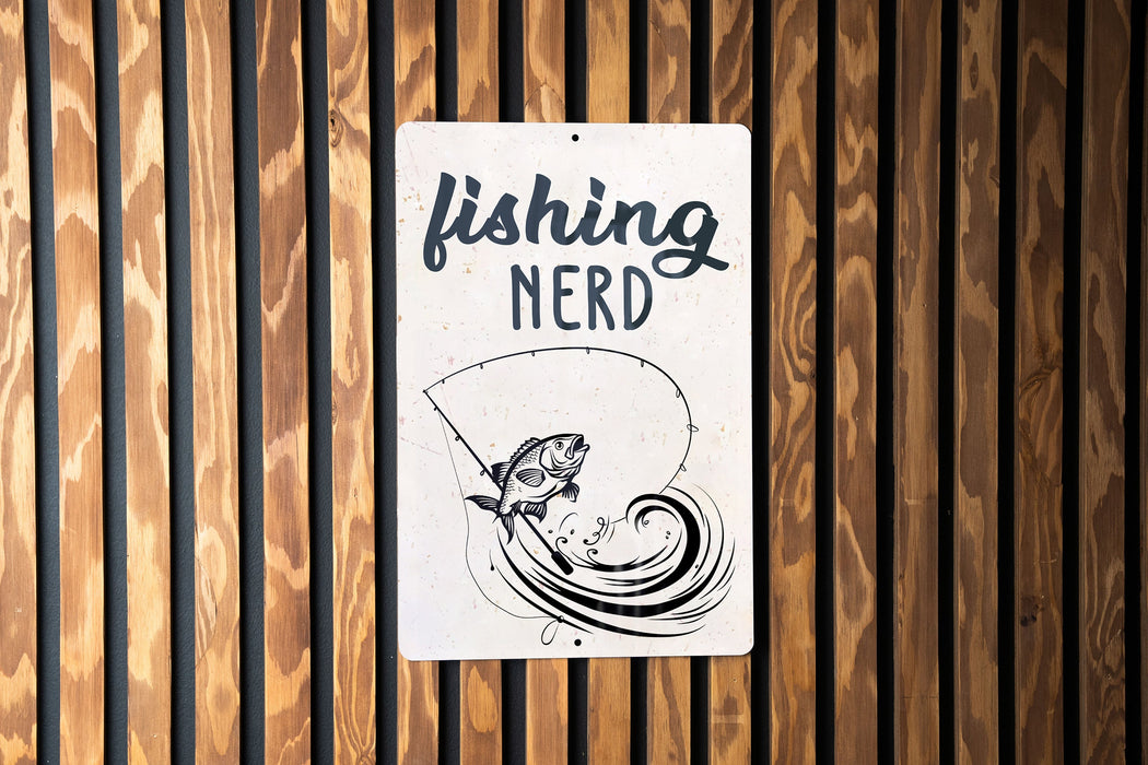 a sign on a wooden wall that says fishing nerd