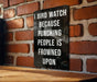 a sign on a brick wall that says, i bird watch because punching people is