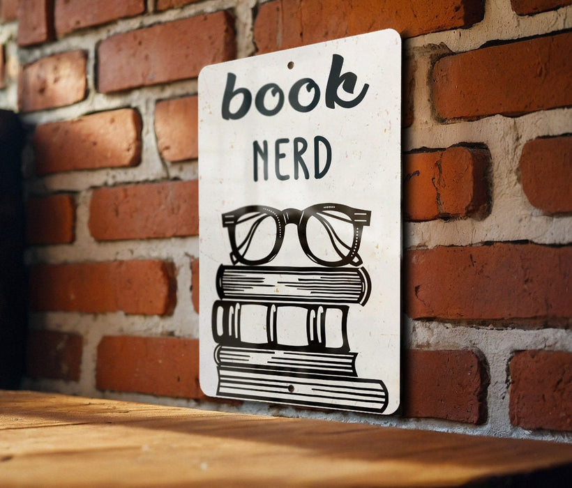 a book nerd sign on a brick wall