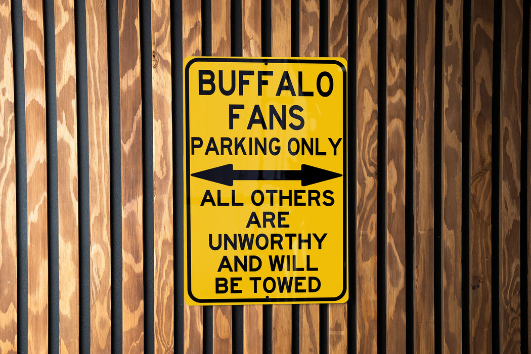 a yellow sign on the side of a building
