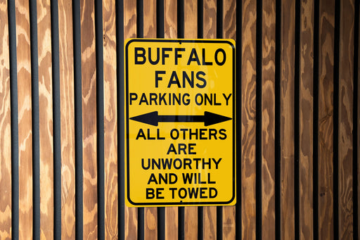 a yellow sign on the side of a building